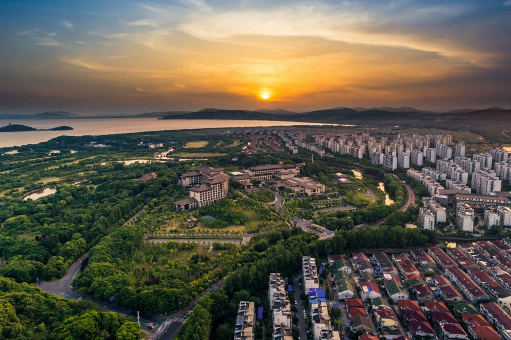 Aerial sunset view of modern residential estate development
