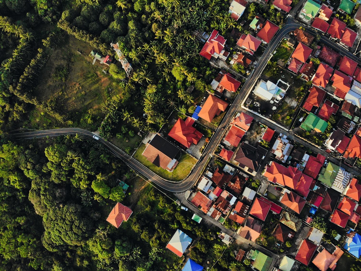 Aerial view of residential estate with colorful rooftops